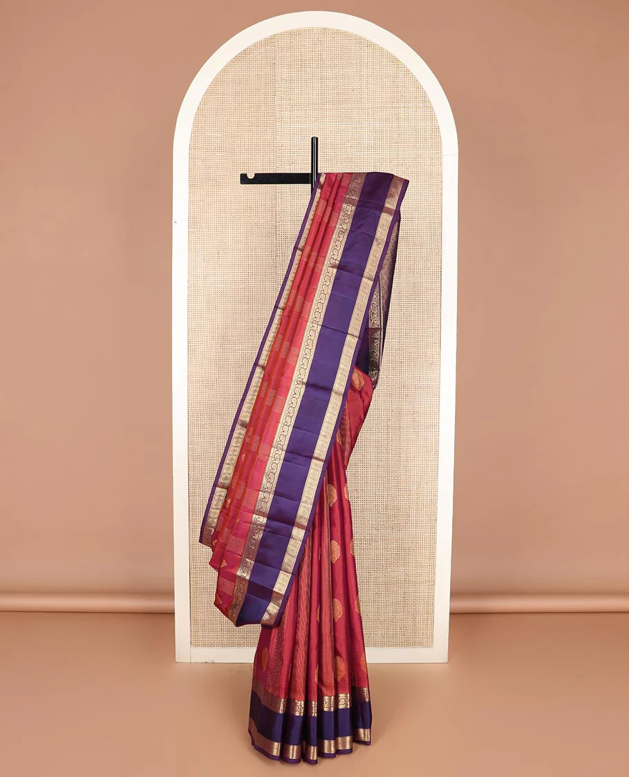 Red buttas and striped Vasundhara silk saree, contrast rettai pettu border of neli, mayil, and diamond designs, and jaal pallu