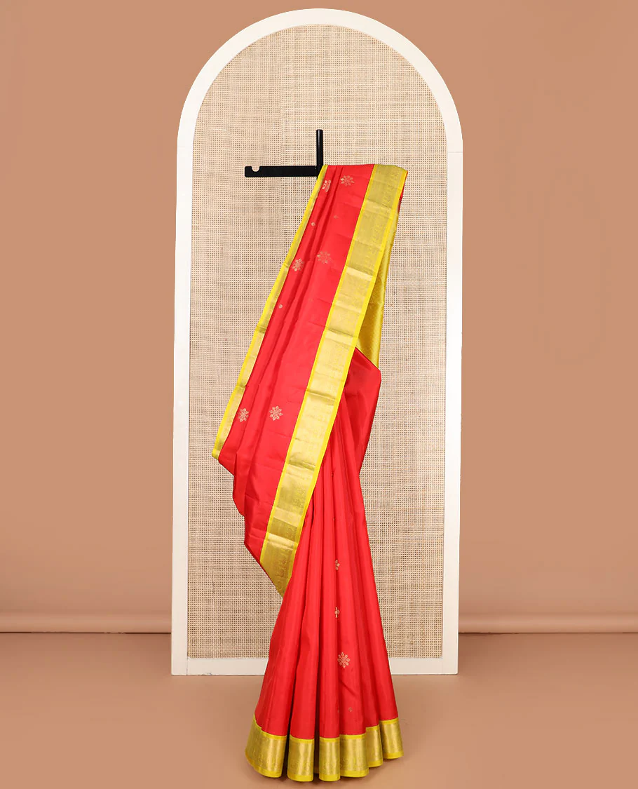 Red buttas Vasundhara silk saree, contrast border of rekku, neli, and mayil designs, and jaal pallu