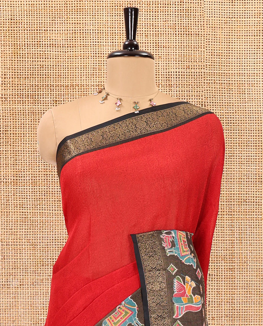 Red embossed moss chiffon saree, contrast zari and colorfully printed border and pallu of human figurines and Pichwai cows, and embossed blouse - Image 3