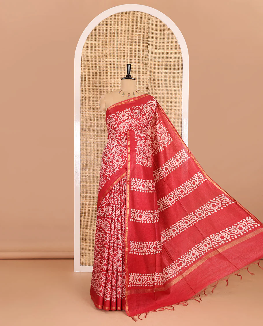 Red floral design batik-printed Bhagalpur cotton saree, zari piping border, batik-printed pallu, and a plain blouse