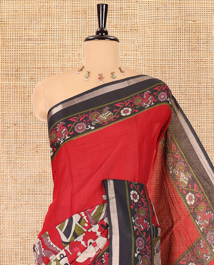 Red human figurines printed muslin cotton saree, contrast floral-peacock printed border of piping work, kalamkari printed pallu, and a contrast blouse of flower motifs print - Image 2