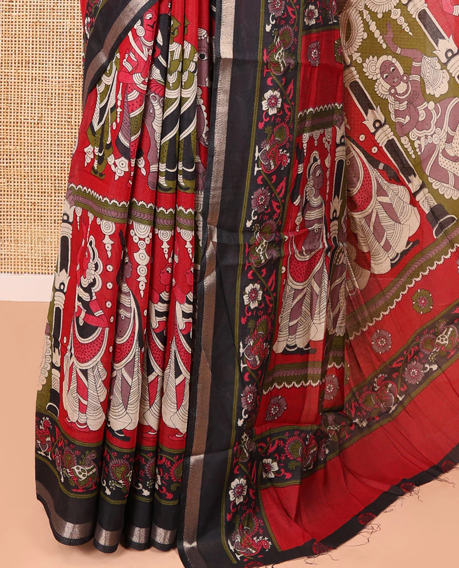 Red human figurines printed muslin cotton saree, contrast floral-peacock printed border of piping work, kalamkari printed pallu, and a contrast blouse of flower motifs print - Image 3