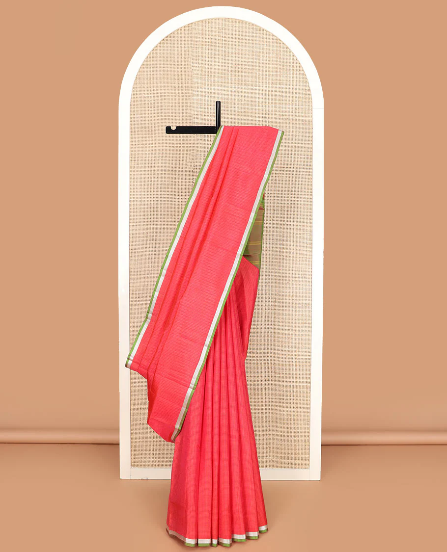 Red micro-checked Kanchipuram silk saree, contrast piping zari border of vanki designs, and striped pallu