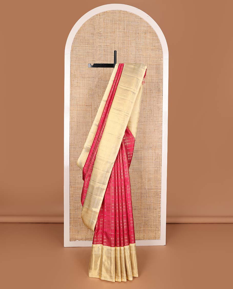Red muthu striped Samudrika silk saree, contrast border of manga mokku, muthu, poun, and mayli kann designs, and zari design pallu