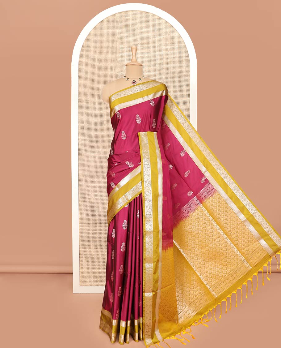 Red Semi-Soft Silk Saree Bedecked with Zari Buttas, Complemented by Contrast Traditional Zari Design Rettai Pettu Border, Pallu Gleamed Up with Scallop Designs, and Paired with a Contrast Blouse