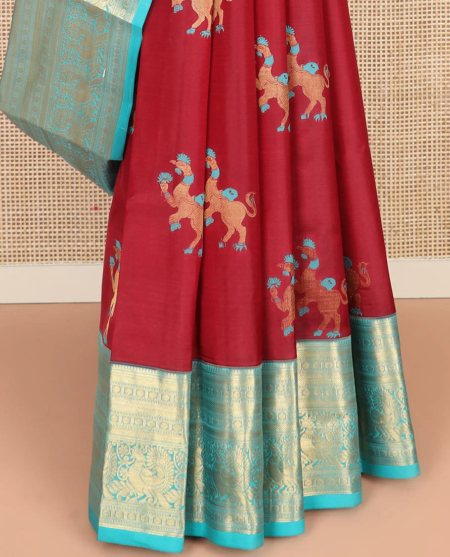 Red Vasundhara Silk Saree, Traditionally Decked up with Navagunjara Buttas, Complemented by a Contrast Border of Rekku, Kathir, Rudraksham, Muthu, and Mayil Designs, Adorned with a Pallu of Jaal Design, and Paired with a Contrast Blouse - Image 4