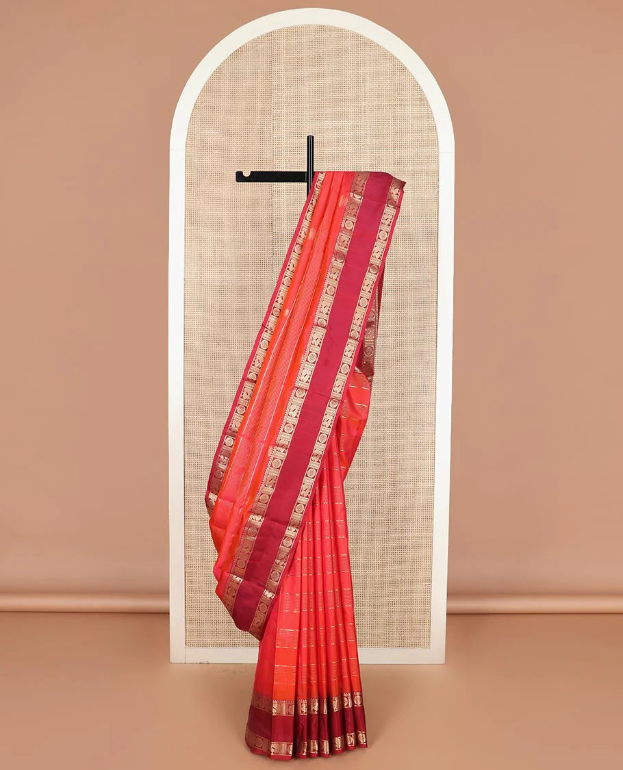 Red zari buttas and iruthalai pakshi buttas Vasundhara silk saree, contrast rettai pettu border of rekku, and annam chakram motifs, and rudraksham butta enclosed jaal designs