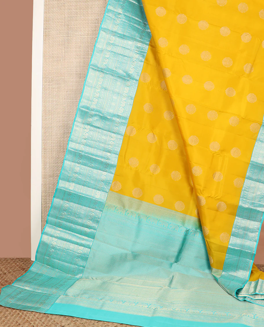 Yellow zari buttas Vasundhara silk saree, contrast border of thilakam mokku, poun, yaanai, chakram, and mayil kann designs, and jaal pallu - Image 3