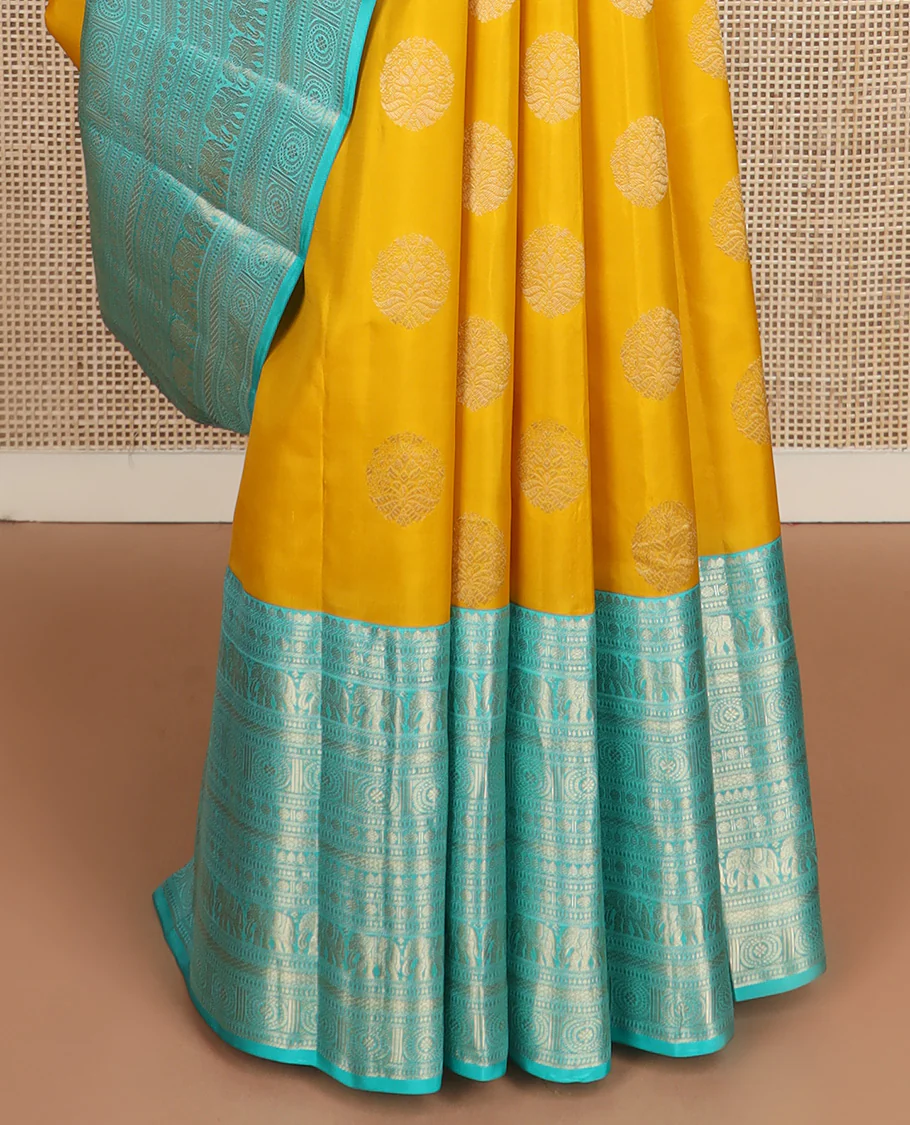 Yellow zari buttas Vasundhara silk saree, contrast border of thilakam mokku, poun, yaanai, chakram, and mayil kann designs, and jaal pallu - Image 5