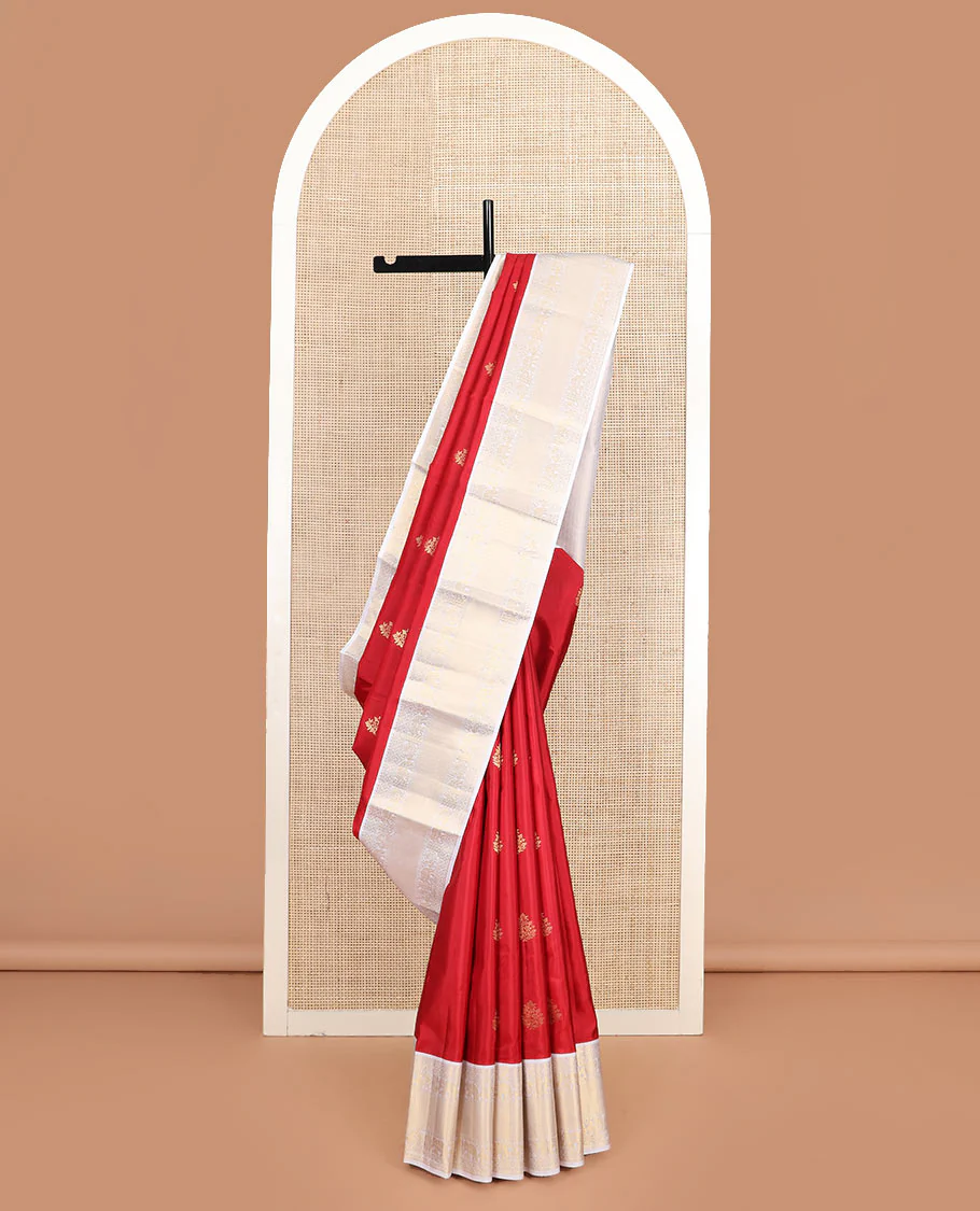 Red zari buttas Vasundhara silk saree, contrast border of rekku, mayil, yaanai, and mayil kann designs, and jaal pallu