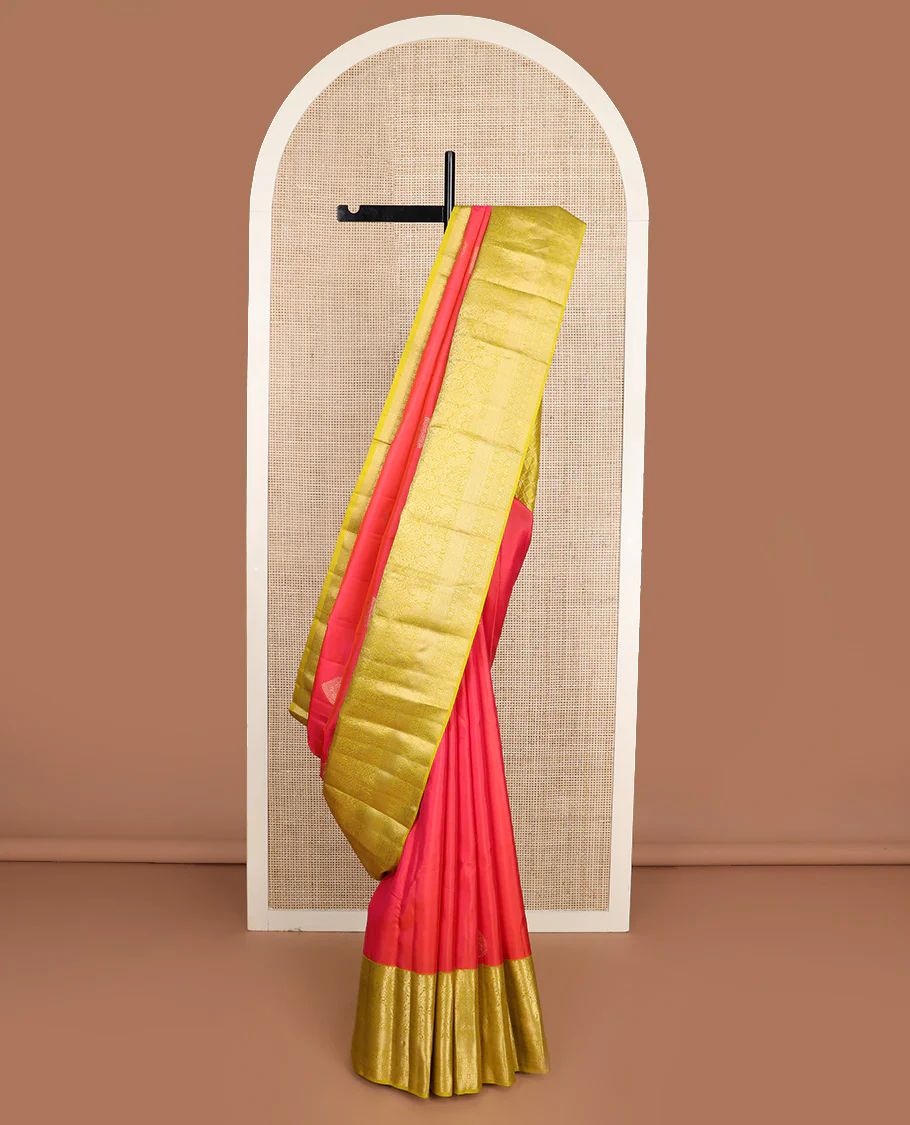 Red zari buttas Vasundhara silk saree, contrast border of thilakam mokku, muthu, yaali, and mayil kann, and geometric pallu