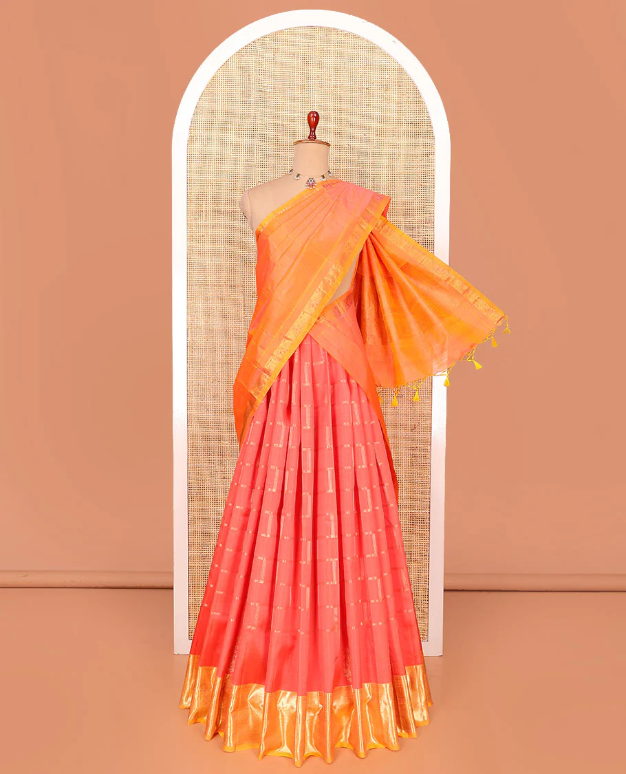 Red zari checked pure-silk half-saree with contrast traditional border of peacock designs, contrast zari bordered blouse, and a dhavani of intricate designs