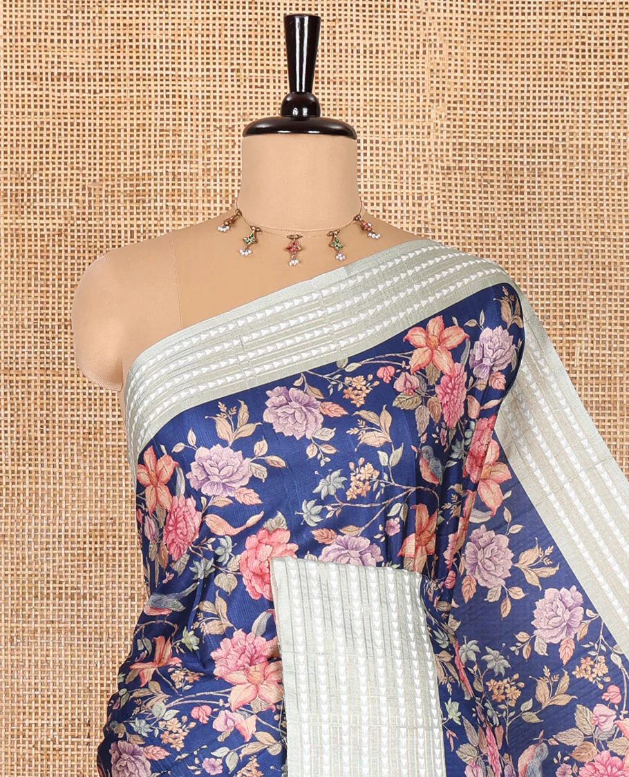 Royal blue colorful floral motifs printed fancy tussar saree, contrast triangle motifs border, striped pallu, and a contrast striped blouse - Image 2