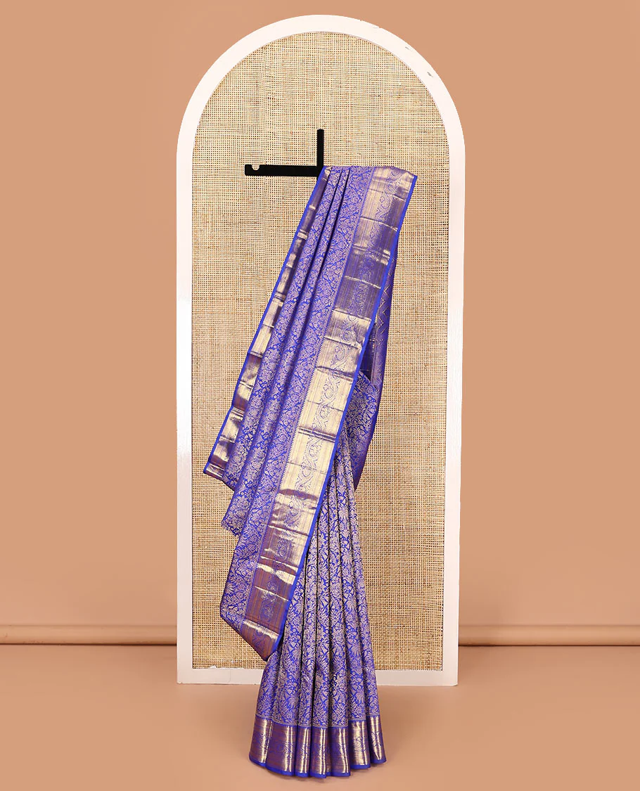 Royal blue jacquard kanchipuram silk saree, zari border of thazampoo rekku, muthu, kathir, kuyil kann, and dhavana kodi designs, and intricate pallu