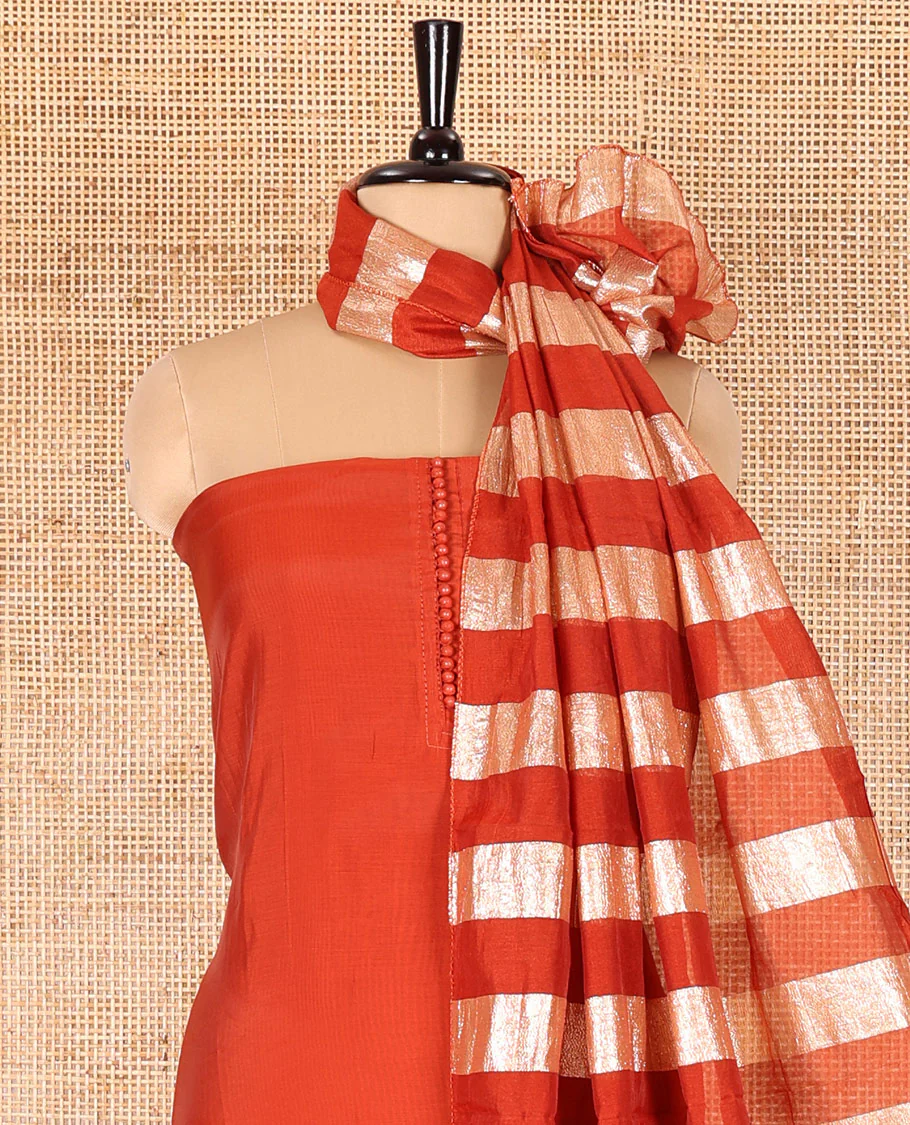 Rust material chudidar set, plain with pom-pom tasseled mul chanderi top, a matching bottom, and organza dupatta of stripes - Image 3