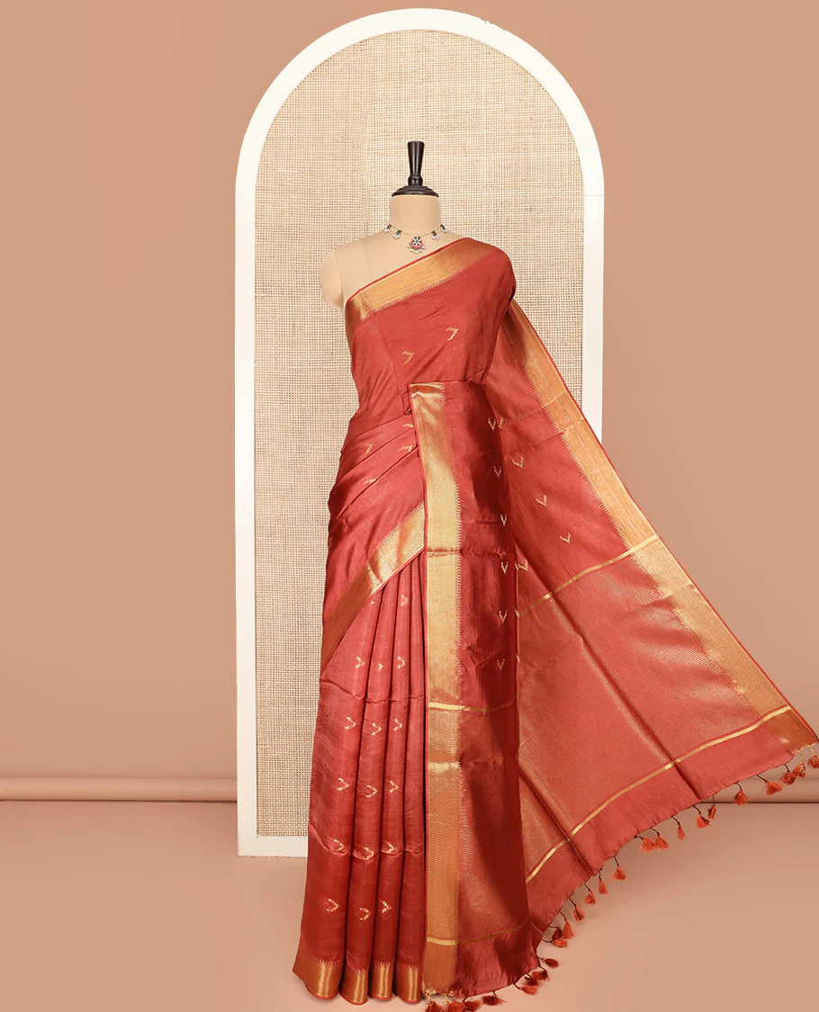 Rust Orange Banana Pith Saree Decorated with Zari Temple Buttas, Delicately Woven Temple Zari Border, Gleaming Zari Pallu of Horizontal Stripes in Zari, and Paired with a Matching Plain Blouse