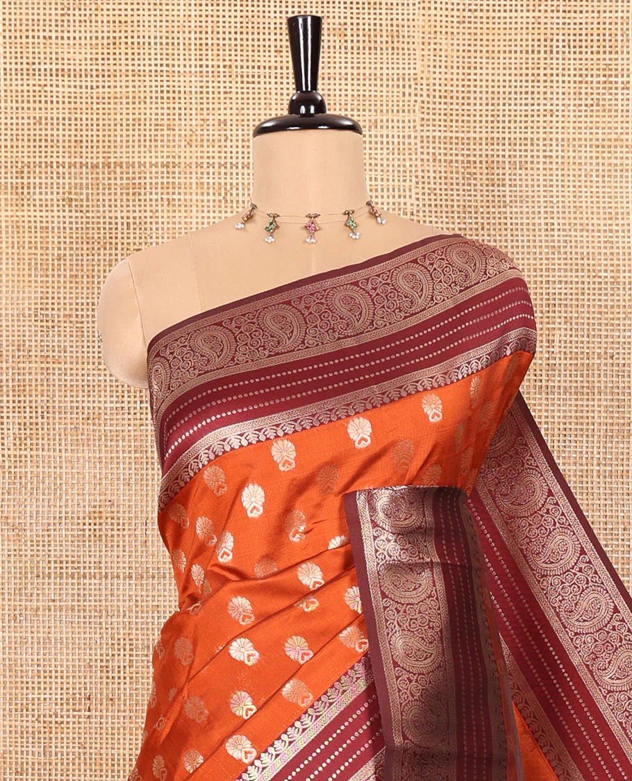Rust Orange Kanchi Silk Saree Gracefully Embellished with Zari Buttas Woven All Over Its Body, Highlighted with a Contrast Traditional Zari Border of Paisleys, Artfully Detailed Pallu of Intricate Designs, and Paired with a Contrast Zari Design Blouse - Image 2