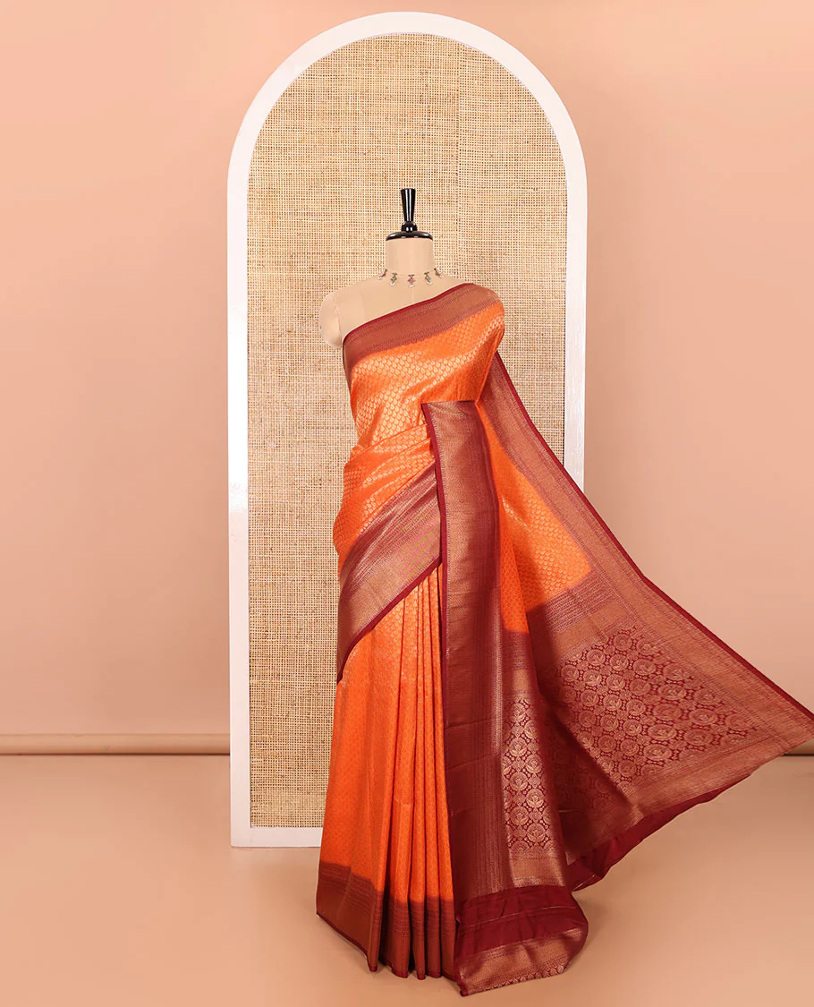 Rust Orange Luxury Soft Silk Saree Featuring Drop-Shaped Zari Motifs Steeped All Over Its Body, Highlighted with a Contrast Traditional Zari Border, Pallu Decked Up with Intricate Designs, and Paired with a Contrast Jacquard Blouse
