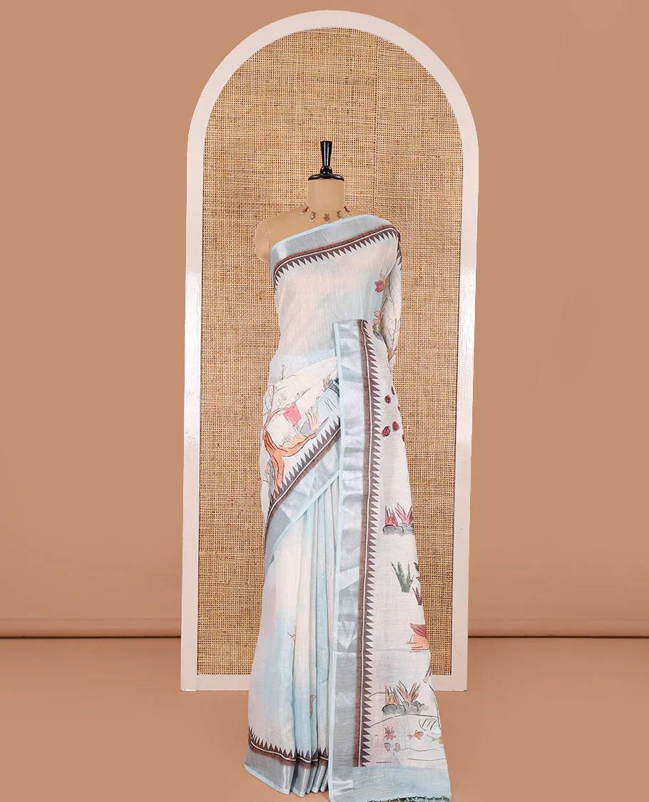 Sky blue nature-theme printed linen cotton saree features flora-fauna motifs, temple bavanji border, nature printed pallu, and a floral motif printed blouse - Image 2