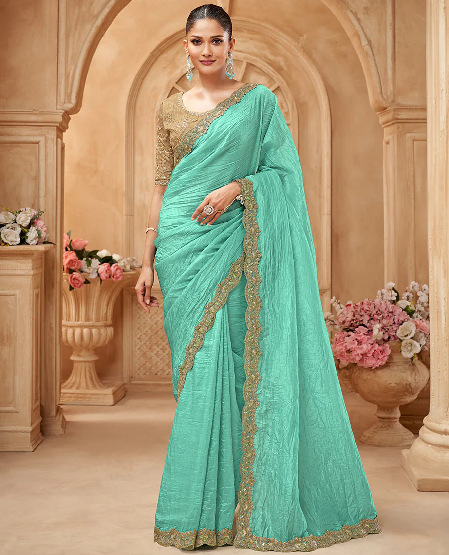 Turquoise crushed designer saree, scallop embroidered border, and contrast embroidered blouse