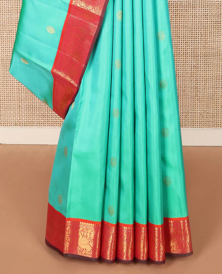 Turquoise mayil buttas silk saree, contrast border of thilakam mokku, muthu, and mayil designs, and jaal pallu - Image 4