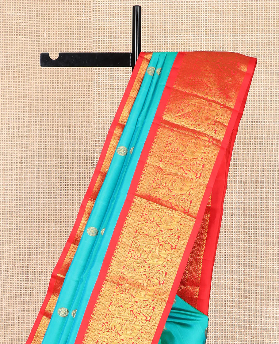 Turquoise mayil chakram buttas Kanchipuram silk saree, contrast border of thilakam mokku, cross kamalam, and mayil designs, and chakram design pallu - Image 3