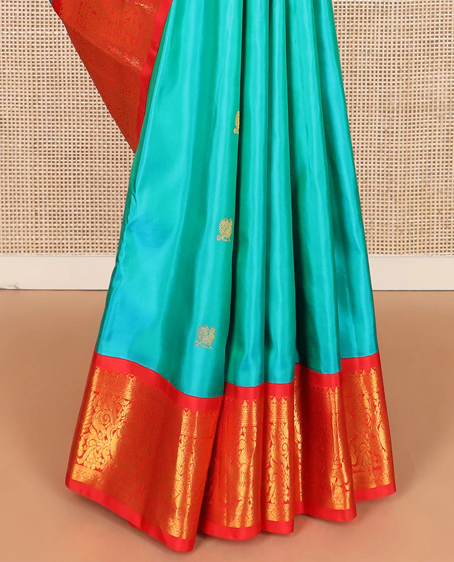 Turquoise mayil chakram buttas Kanchipuram silk saree, contrast border of thilakam mokku, cross kamalam, and mayil designs, and chakram design pallu - Image 4