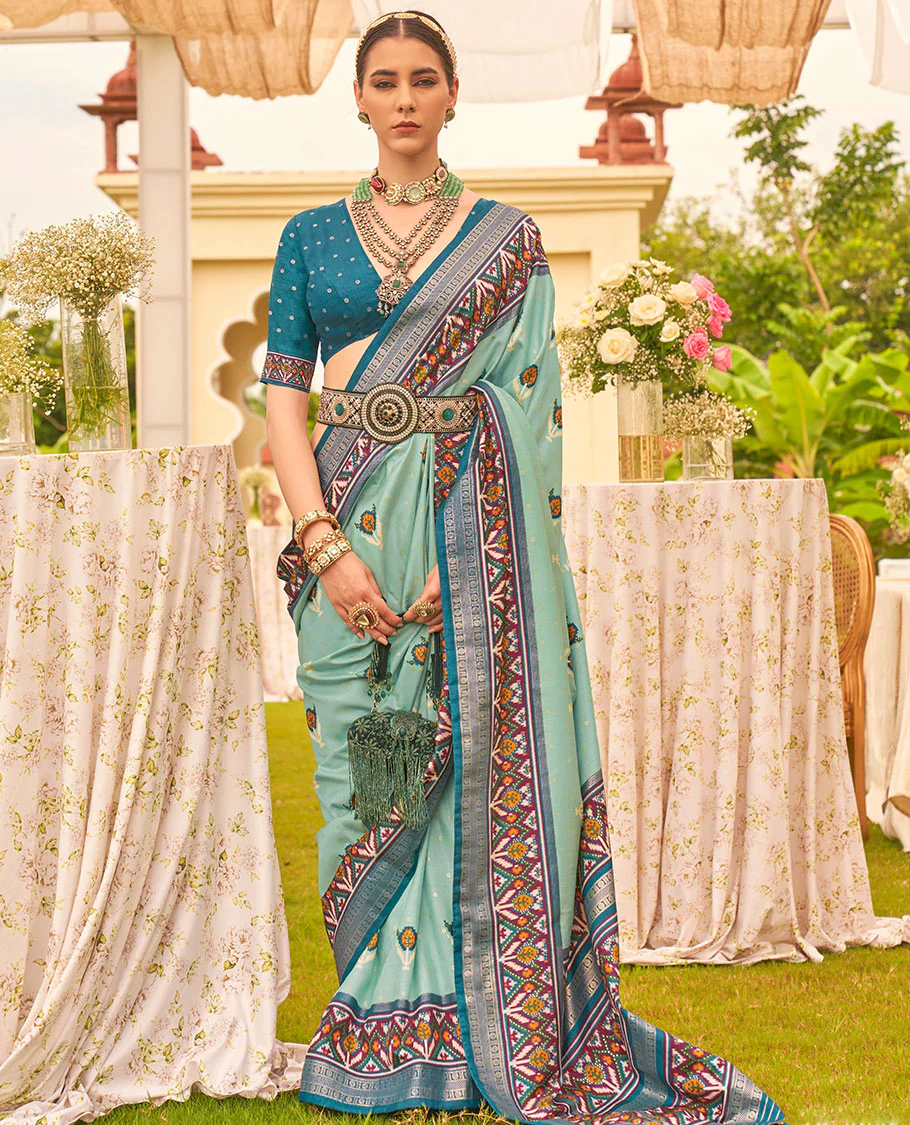 Turquoise patola floral motifs printed designer saree, contrast intricate patola border, and floral motifs patola printed pallu