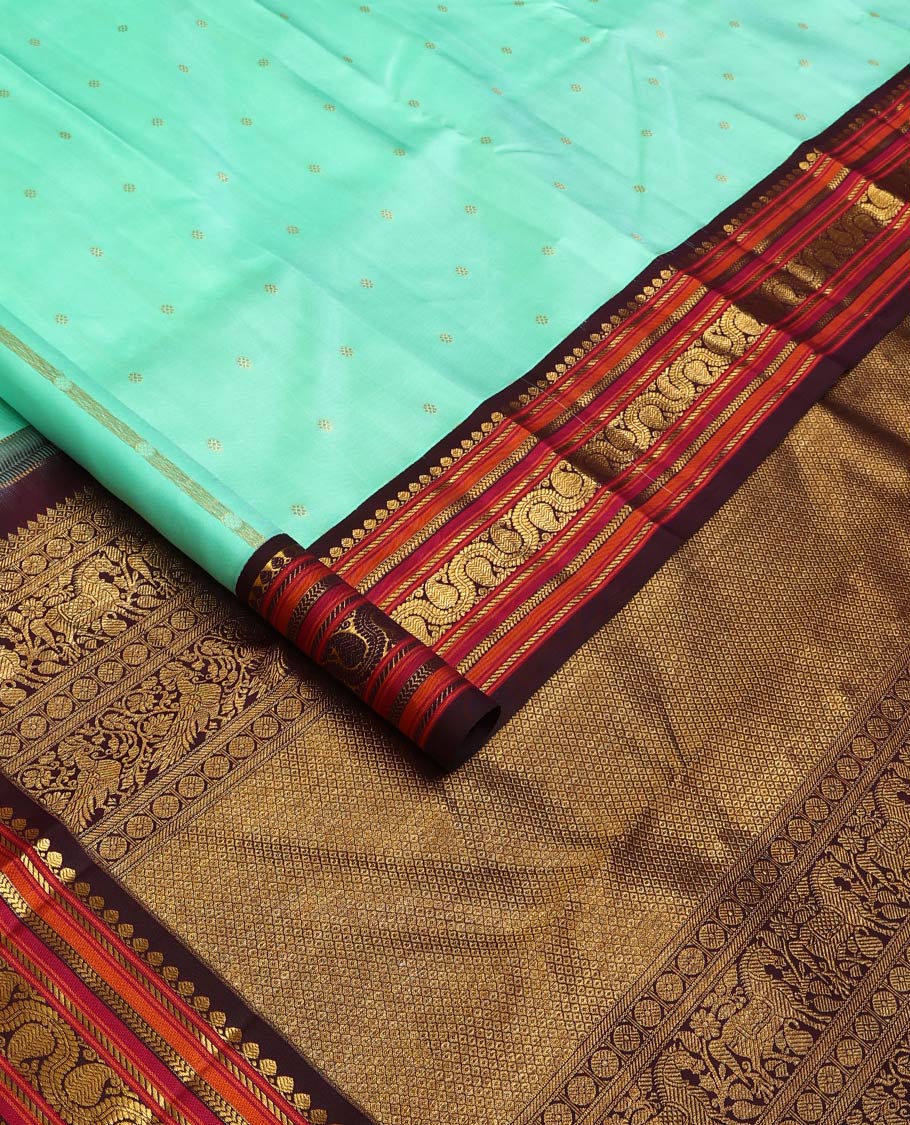 Turquoise zari buttas Kanchipuram silk saree, contrast korvai border of salangai, nuli nagam, kathir, and dhavanai manga kodi designs, and mayil kann woven pallu - Image 2