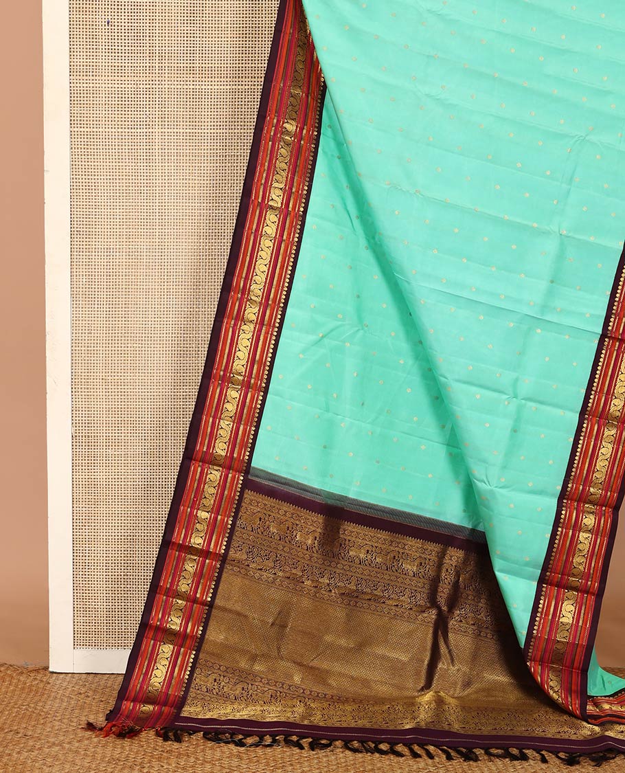 Turquoise zari buttas Kanchipuram silk saree, contrast korvai border of salangai, nuli nagam, kathir, and dhavanai manga kodi designs, and mayil kann woven pallu - Image 3