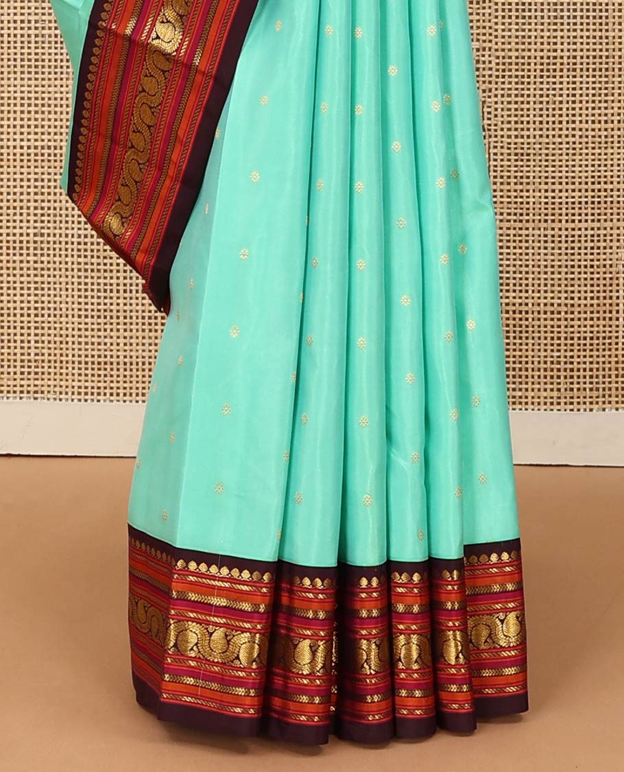 Turquoise zari buttas Kanchipuram silk saree, contrast korvai border of salangai, nuli nagam, kathir, and dhavanai manga kodi designs, and mayil kann woven pallu - Image 5