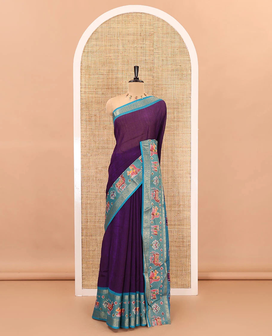Violet embossed moss chiffon saree, contrast zari and colorfully printed border and pallu of human figurines and Pichwai cows, and embossed blouse - Image 2