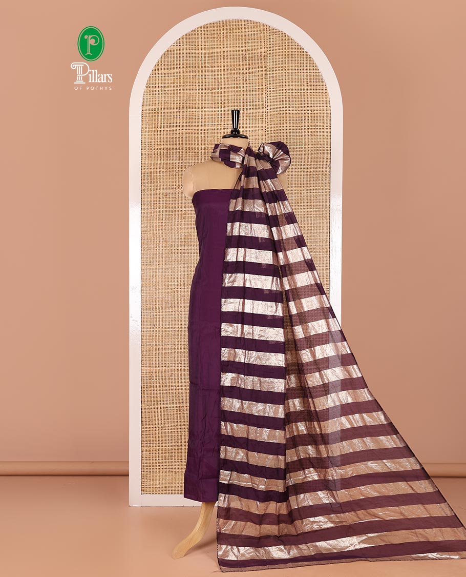 Violet material chudidar set, plain with pom-pom tasseled mul chanderi top, a matching bottom, and organza dupatta of stripes