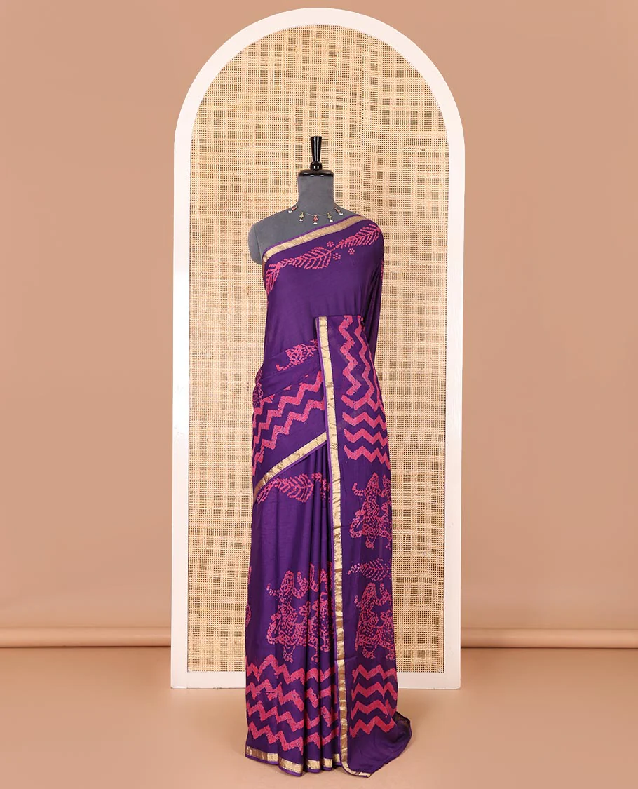 Violet wax batik-style zig-zag printed pure cotton saree, gold zari piping border, human figurines batik printed pallu, and a matching blouse - Image 2