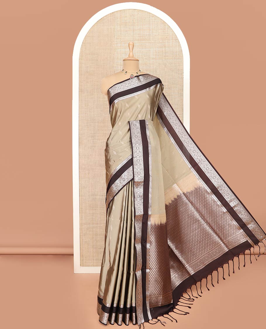 Warm Ivory Semi-Soft Silk Saree Prettified with Zari Buttas, Complemented by Contrast Traditional Zari Design Rettai Pettu Border, Majestically Detailed with Pallu of Jaal Designs, and Paired with a Contrast Blouse