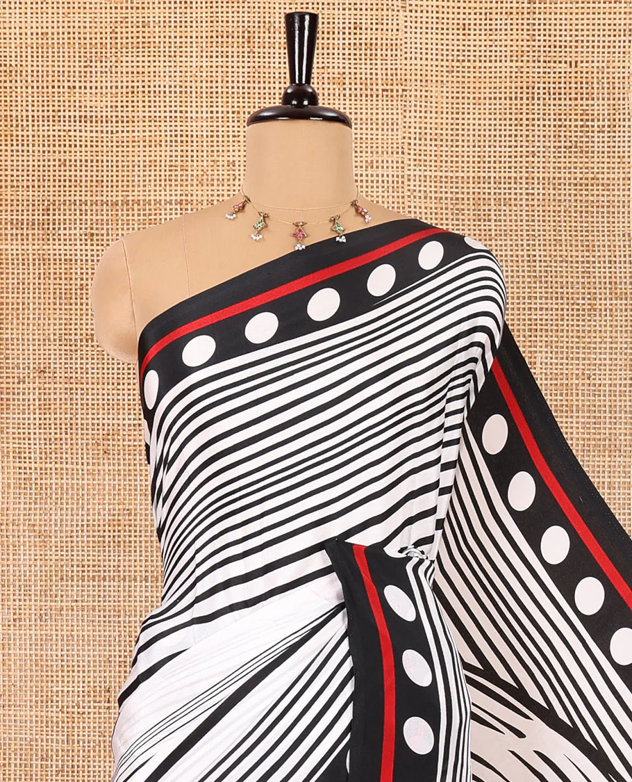 White and black horizontal stripes and wavy patterned crepe silk saree, small coin buttas printed blouse, big circle motifs printed pallu, and a plain blouse - Image 2