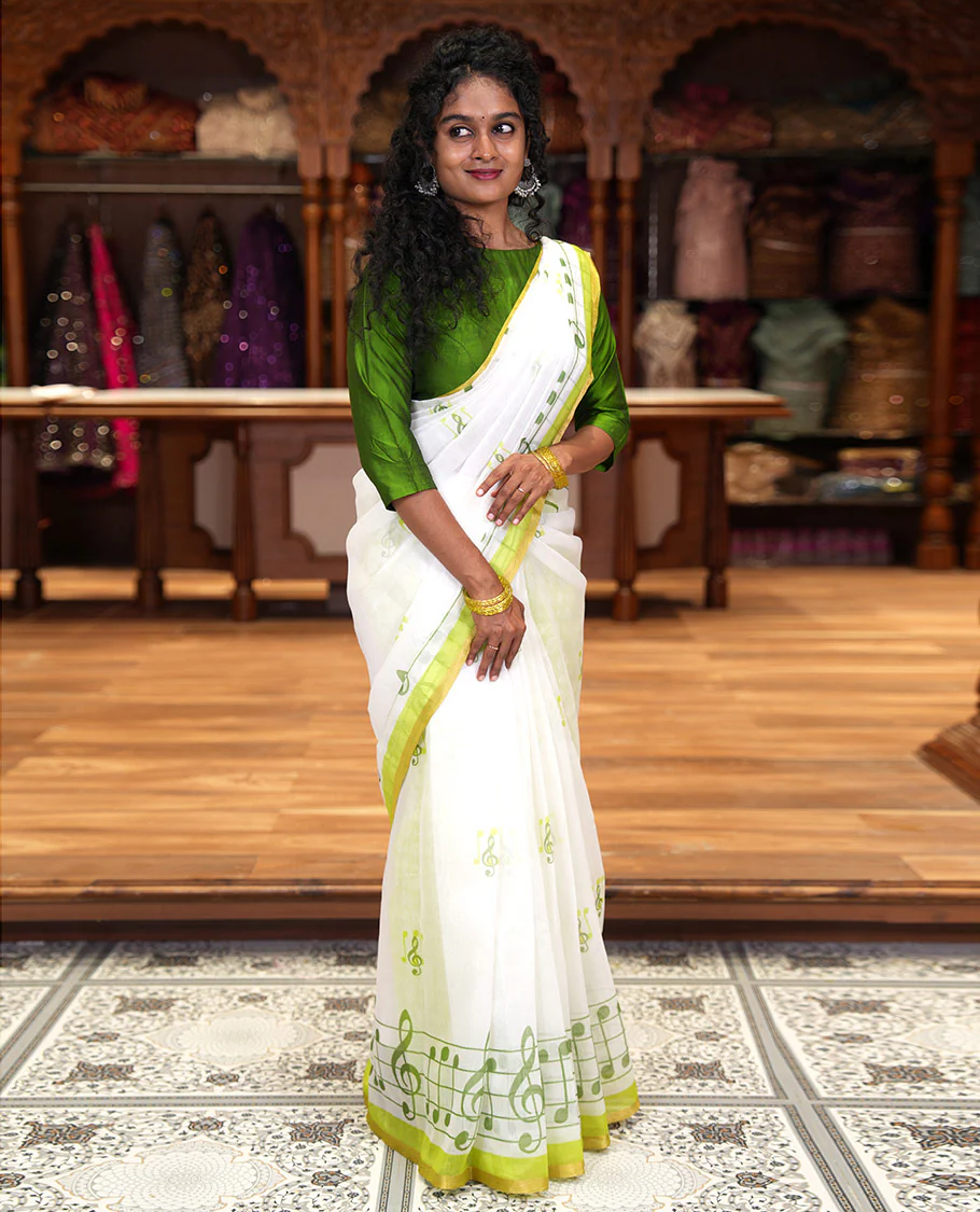 White and green musical note motifs printed Chanderi cotton saree, zari piping border, geometric printed pallu, and a unique motifs printed blouse - Image 2