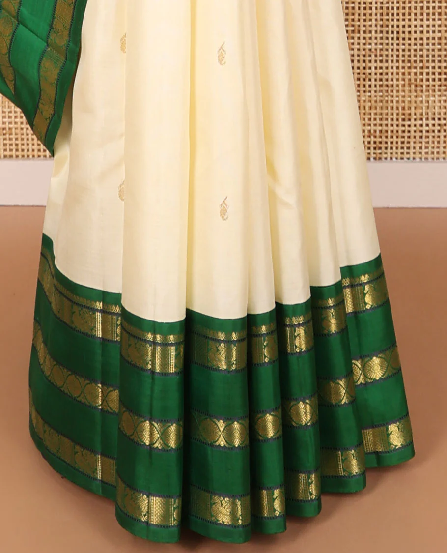White floral buttas kancheepuram silk saree with contrast ganga jamuna, korvai border of thilakam mokku, poo chakram, mayil design & zari design pallu - Image 6