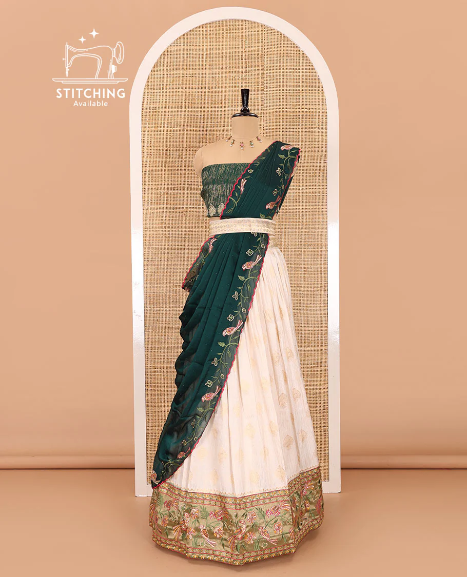 White-green half-saree, buttas with contrast bird motifs embroidered with stone work, bordered patola silk skirt, zari brocade blouse, and a Syska georgette embroidered dhavani - Image 3