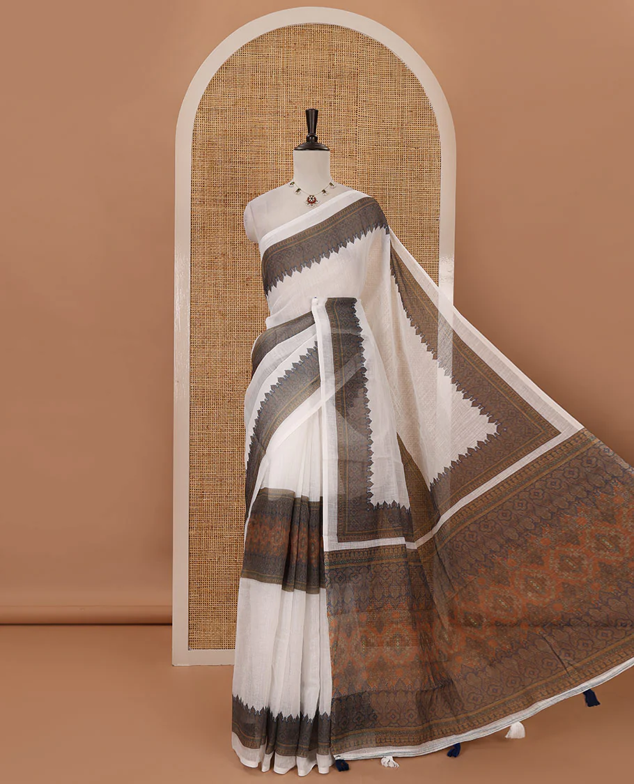 White half-plain & half-printed body linen cotton saree, intricately printed border, printed pallu & printed blouse
