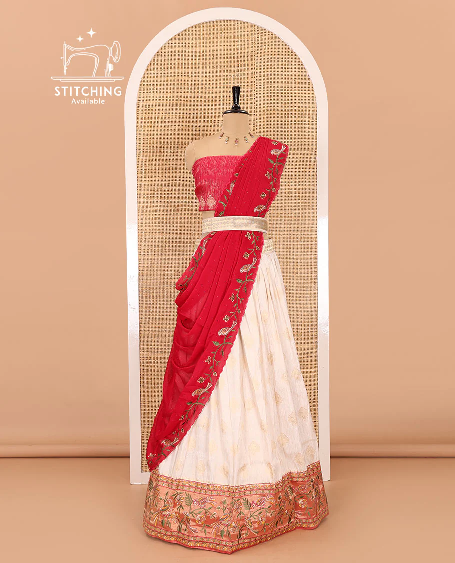 White-red half-saree, buttas with contrast bird motifs embroidered with stone work, bordered patola silk skirt, zari brocade blouse, and a Syska georgette embroidered dhavani