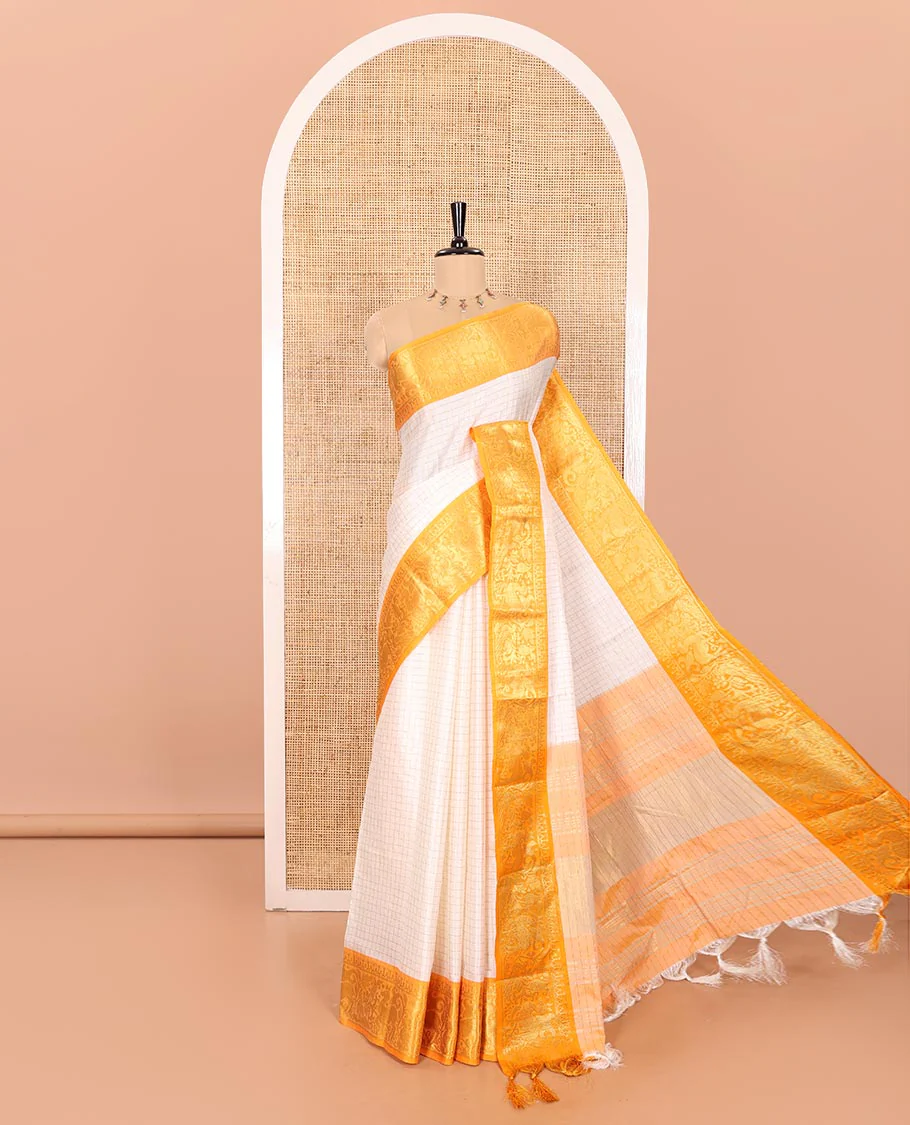 White Semi-Taffeta Saree Enthralled with Medium-Sized Zari Checks, Complemented with a Contrast Border Featuring Floral and Deer Motifs in Zari, Pallu of Stripes, and Paired with a Contrast Blouse