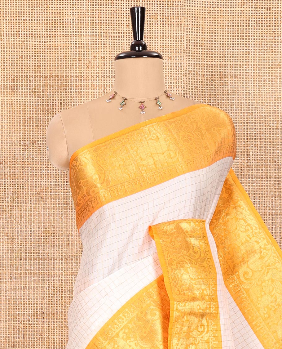 White Semi-Taffeta Saree Enthralled with Medium-Sized Zari Checks, Complemented with a Contrast Border Featuring Floral and Deer Motifs in Zari, Pallu of Stripes, and Paired with a Contrast Blouse - Image 2