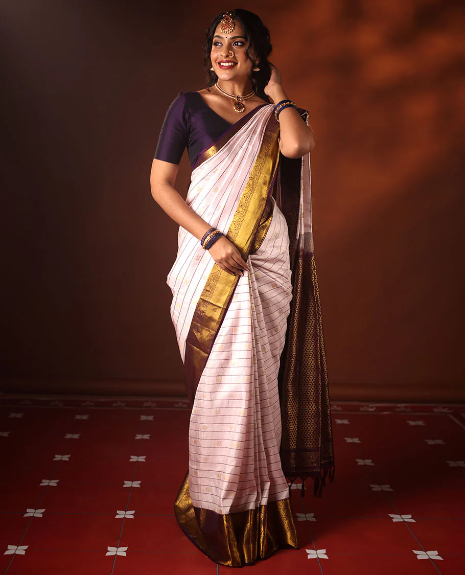 White Vasundhara silk saree adorned with Mayil Chakram, Neli, and Muthu stripes, featuring a contrast border with Laddu Kamalam, Mayil, Yaali, and Mayil Kann designs, along with a Jaal design pallu - Image 3