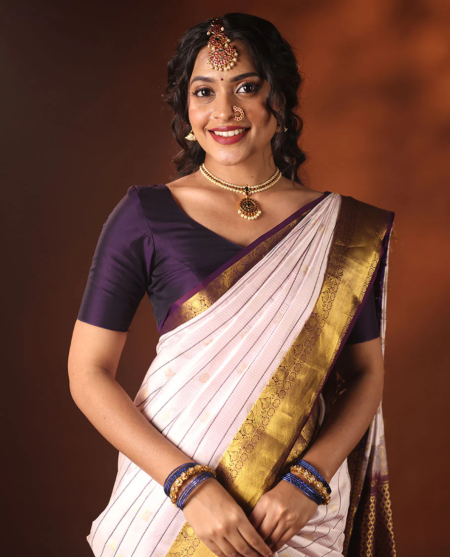 White Vasundhara silk saree adorned with Mayil Chakram, Neli, and Muthu stripes, featuring a contrast border with Laddu Kamalam, Mayil, Yaali, and Mayil Kann designs, along with a Jaal design pallu - Image 5