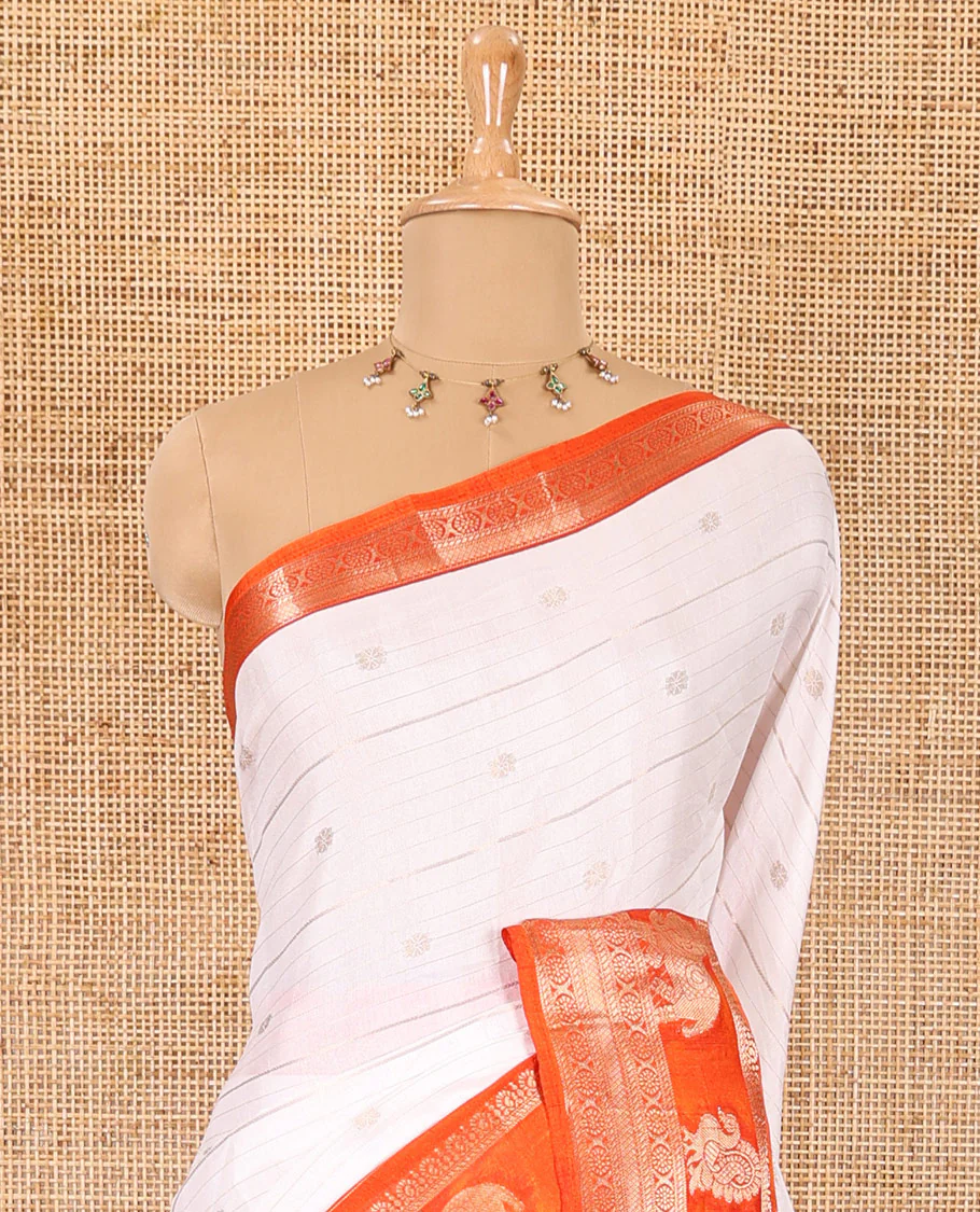 White zari buttas and striped dola silk saree, contrast traditional zari border of elephant and peacock buttas, zari design pallu, and a contrast floral print with zari work blouse - Image 3
