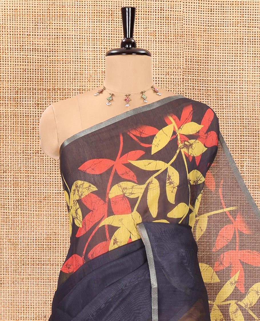 Yellow and black batik print and leaf vine printed linen saree, zari piping border, printed pallu, and a contrast batik printed blouse - Image 2