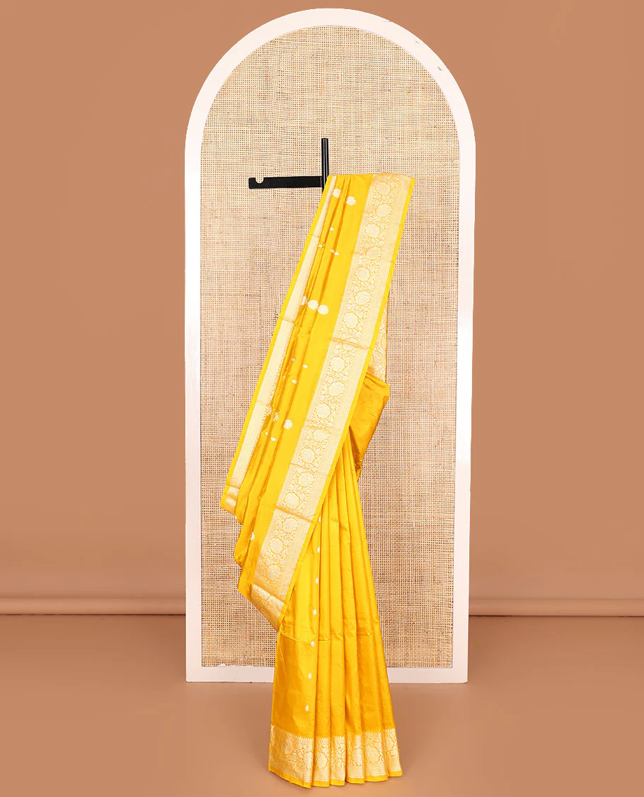 Yellow buttas banarasi kathan silk saree, floral creeper border, and pallu of paisley jaal design