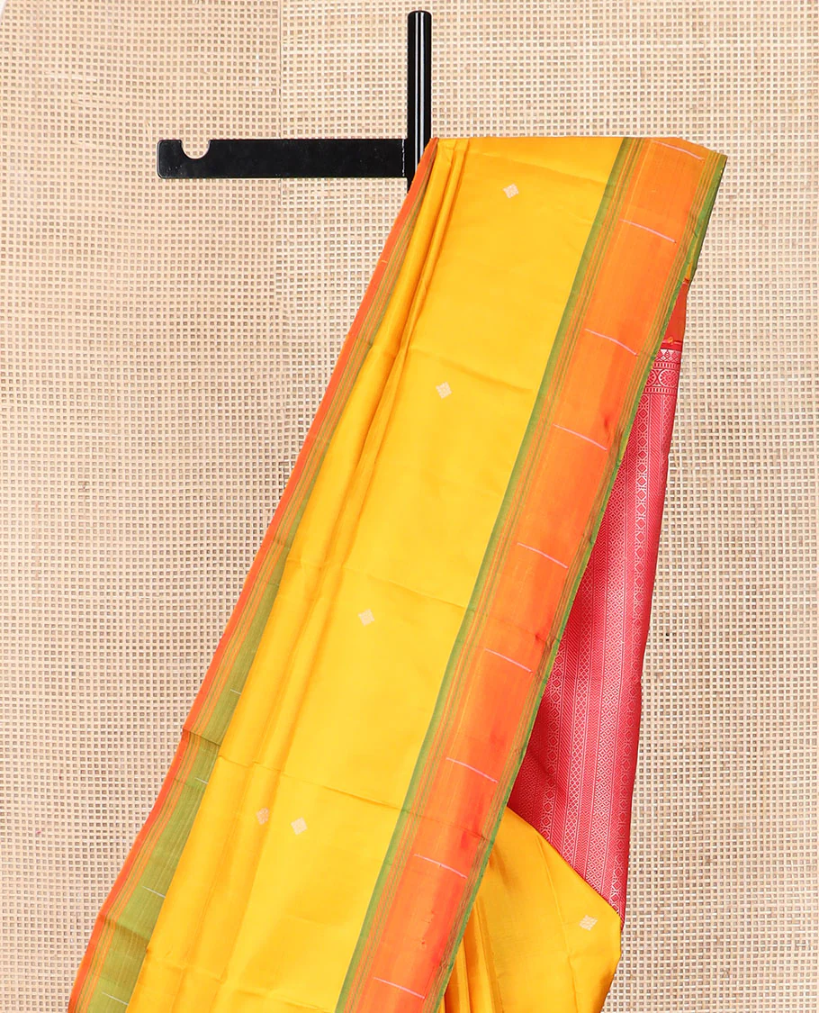 Yellow buttas Kanchipuram silk saree, contrast border of malli mokku designs, and pallu of geometric designs - Image 4