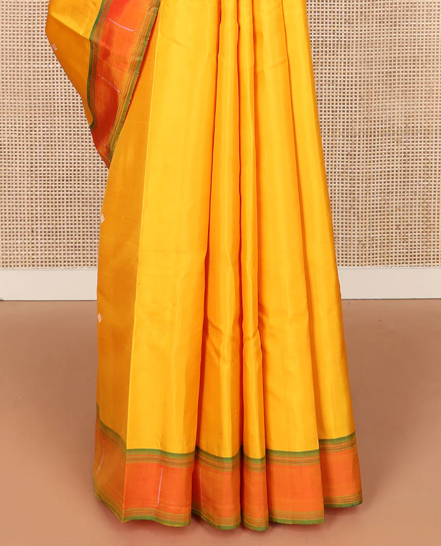 Yellow buttas Kanchipuram silk saree, contrast border of malli mokku designs, and pallu of geometric designs - Image 5